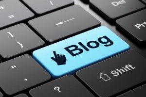 Web development concept: Mouse Cursor and Blog on keyboard